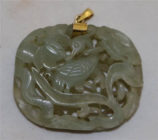 A Chinese celadon jade crane and lotus openwork plaque, Ming dynasty, 4.7cm, later gold mount